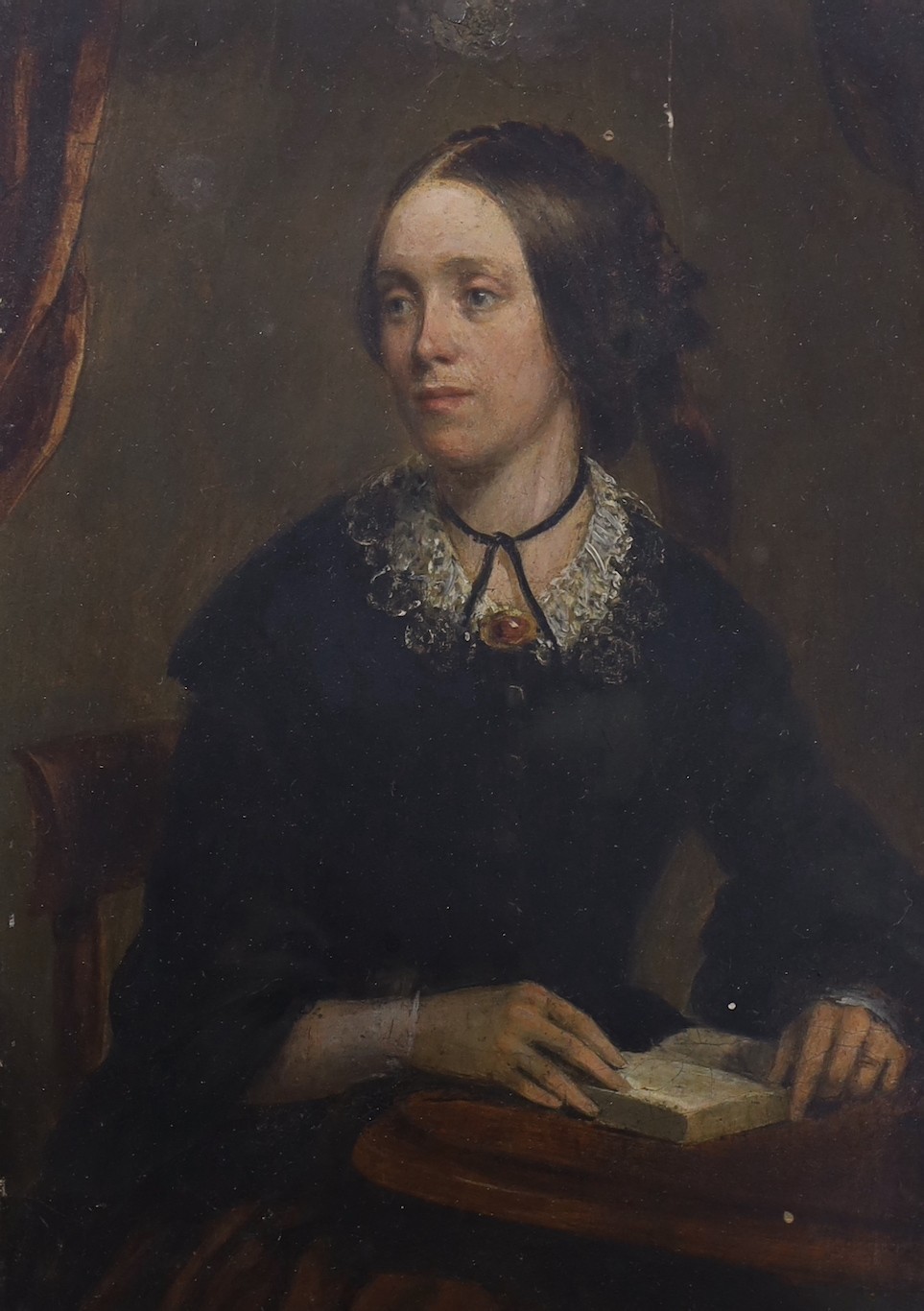 English School, mid 19th century, oil on board, Half length portrait of a seated Victorian lady, 16 x 11cm